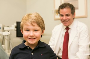 Babylon Dental Care pediatric dentist with a patient
