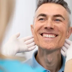 smiling-man-jaw-facial-examination