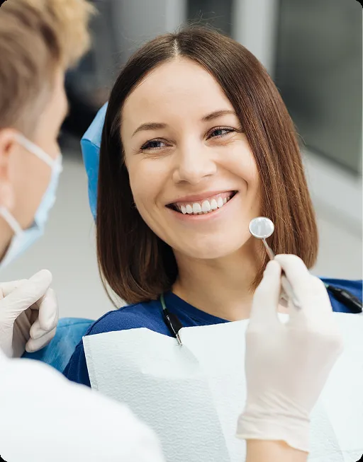 Depiction of a happy woman sitting on a dental chair smiling at dentist